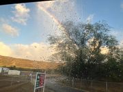 帰りの車窓から見る雨上がりの虹